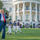 Compulsive liar Donald Trump plays catch on the White House lawn.